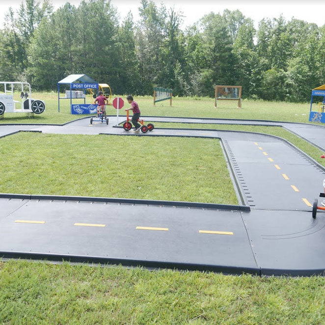Modular Trike Paths vs. Poured-in-Place Rubber: A Cost-Benefit Analysis for Schools, Churches & Daycares